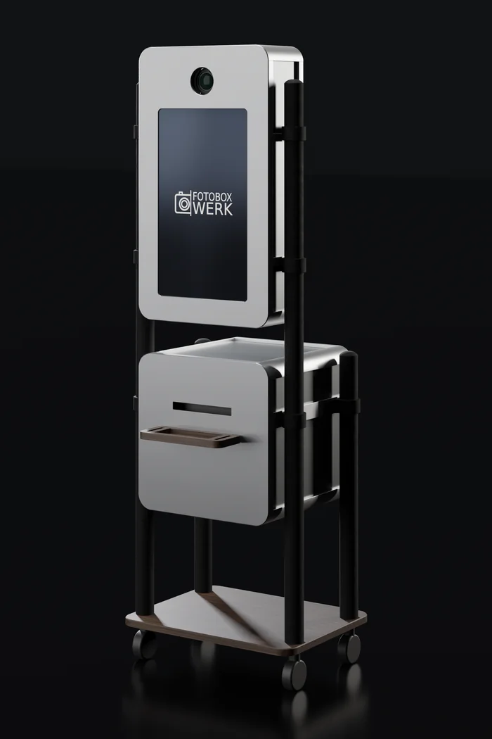 Mod. 2, Fotobox mit eingefasstem Monitor am Rohrgestell, Druckmodul darunter